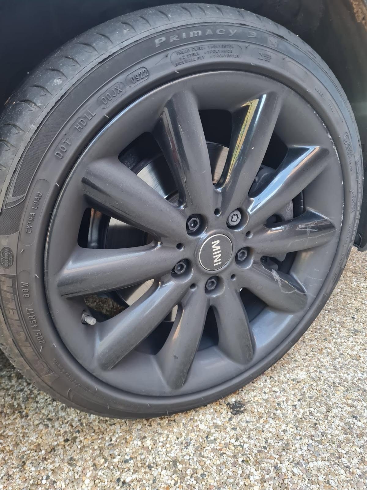 Damaged MINI alloy wheel before refurbishment